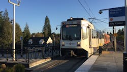 A Type 1 MAX train arrives at the Milwaukie/Main St MAX Station.