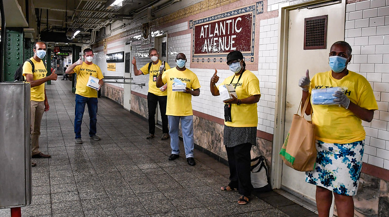 MTA's 'Mask Force' distributing disposable masks to riders in July.