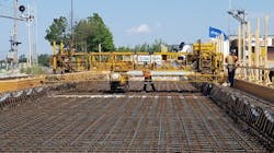 Construction crews preparing to pour concrete for the bridge deck. Construction crews preparing to pour concrete for the bridge deck.