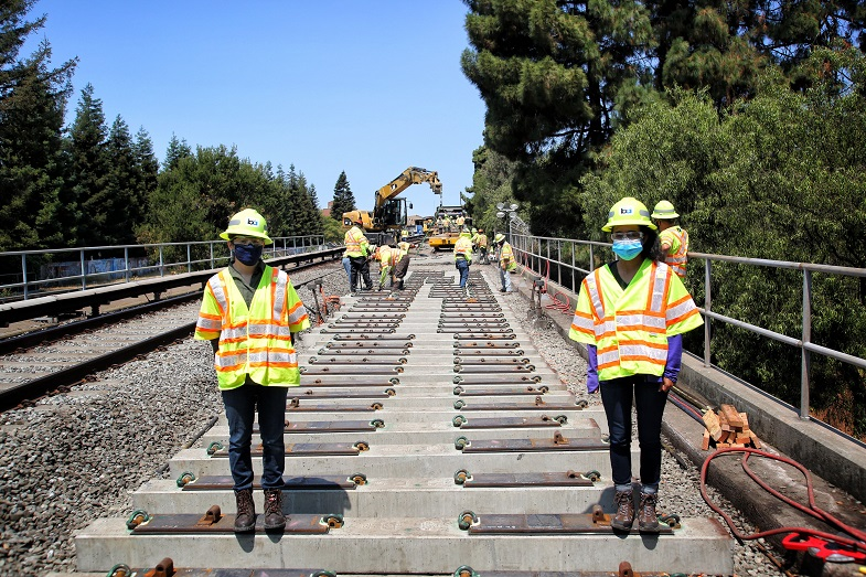 Iris Nunez, (left) track engineering intern, and Ann Cherayil, construction engineering intern, work the A65 Hayward track replacement project.