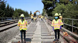 Iris Nunez, (left) track engineering intern, and Ann Cherayil, construction engineering intern, work the A65 Hayward track replacement project.