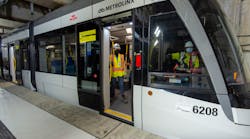 Crews sit in the parked light rail vehicle at Keelesdale Station as part of recent testing.