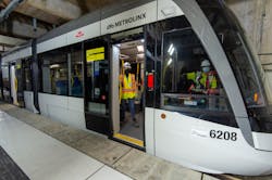 Crews sit in the parked light rail vehicle at Keelesdale Station as part of recent testing.
