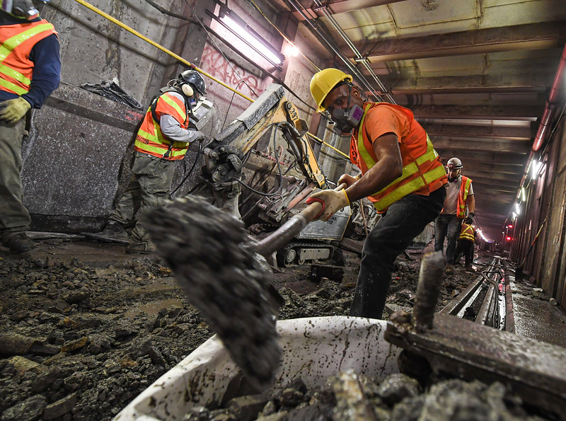 Contractors performing work on the Archer Avenue E line at Sutphin Blvd-Archer Av-JFK Airport station on Wednesday, Sept. 30, 2020.