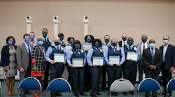 County leadership poses with bus operator graduates: Marvin Alvarez, Verna Baker, Shalona Bennette, Tony Hampton, Molene Innocent, Tammy Jackson, Wallace James, Carlos Martinez, Alfreda McCoy and Neil McPherson