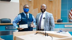 Bus Operator J. LaPrice Williams poses with Executive Director Clinton B. Forbes Bus Operator J. LaPrice Williams poses with Executive Director Clinton B. Forbes