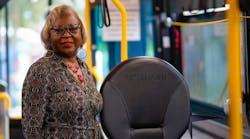 Palm Beach County Administrator Verdenia Baker shows one of the new wheelchair securement devices.