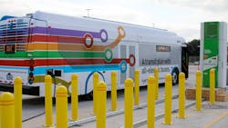 A New Flyer bus is charged using a Proterra charger. A New Flyer bus is charged using a Proterra charger.