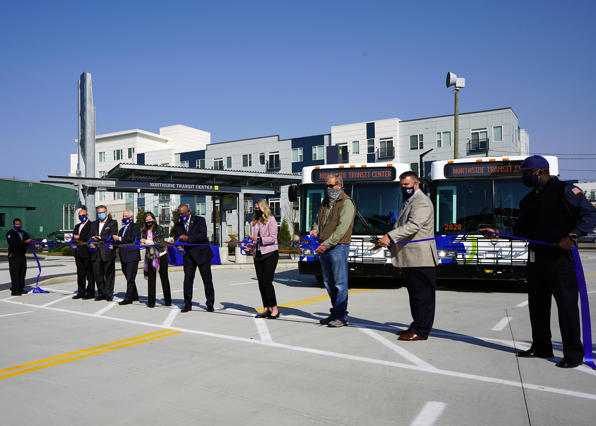 Local officials celebrate the opening of the new transit center.
