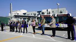 Local officials celebrate the opening of the new transit center.