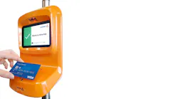 Passenger paying for travel with contactless Visa card.
