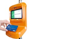 Passenger paying for travel with contactless Visa card. Passenger paying for travel with contactless Visa card.