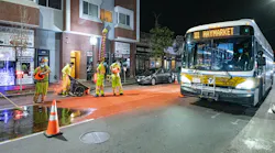 Construction crews installing bus lane markings on Broadway in Chelsea in October 2020.