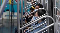 New York City Transit subway riders in face coverings.