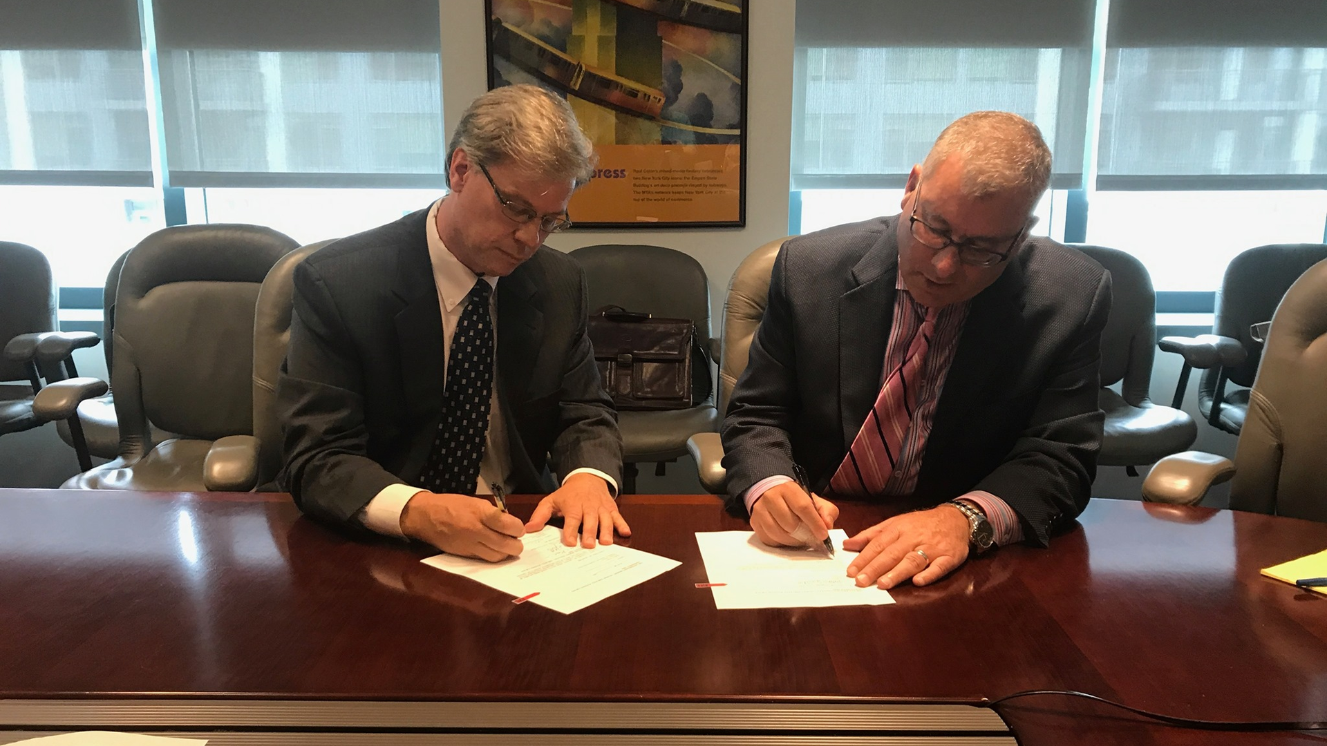 Left, District Board of Directors Chair Charles Stone and San Mateo County Transit District CEO and General Manager Jim Hartnett, who will step down in April 2021.