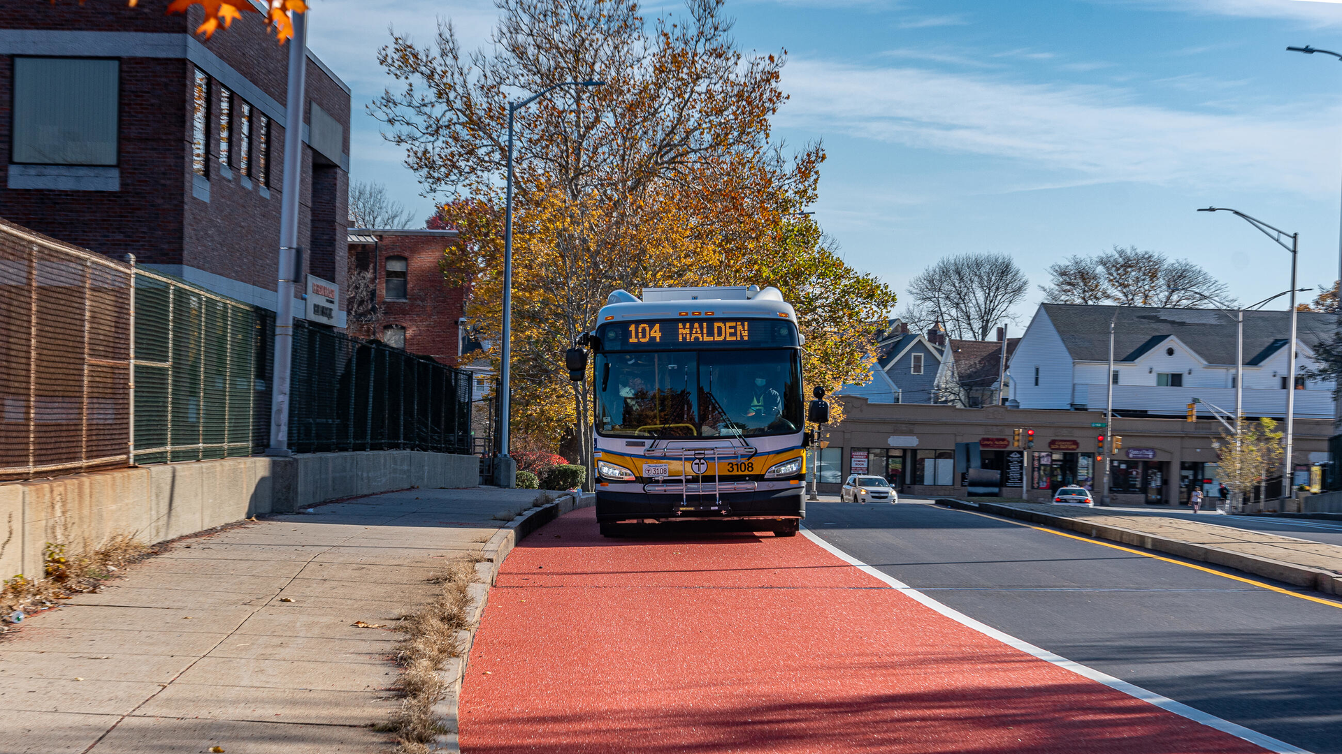 Route 104 bus using the new Florence Street bus lane approaching Malden Center Station.