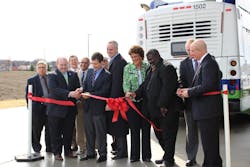 Then-Mayor Pete Buttigieg, center, at a ribbon-cutting ceremony in South Bend to celebrate a new CNG fueling facility that is used by both the transit system and the city.