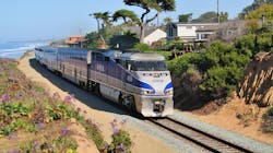 An Amtrak train traveling along tracks that are situated on the Del Mar Bluffs along the LOSSAN Corridor in southern California. An Amtrak train traveling along tracks that are situated on the Del Mar Bluffs along the LOSSAN Corridor in southern California.