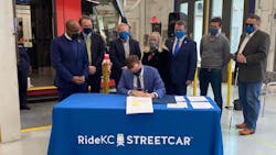 City Manager for Kansas City, Mo., Brian David Platt, seated, signs the FFGA finalizing the $174-million in funds through the CIG Program for the KC Streetcar Main Street extension. City Manager for Kansas City, Mo., Brian David Platt, seated, signs the FFGA finalizing the $174-million in funds through the CIG Program for the KC Streetcar Main Street extension.