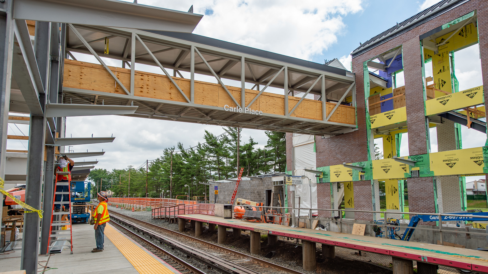 Carle Place pedestrian bridge being installed.