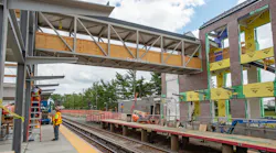 Carle Place pedestrian bridge being installed.