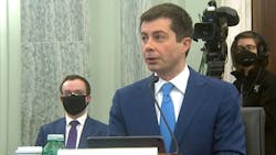 Secretary Buttigieg testifies in front of a Senate Committee Jan. 21 with his husband, Chasten, seated behind him. The secretary noted the importance of this moment as the first openly gay Cabinet member in history.