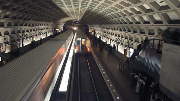 Trains move through the Farragut West Metrorail station on the Orange and Blue lines.