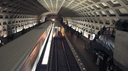 Trains move through the Farragut West Metrorail station on the Orange and Blue lines.