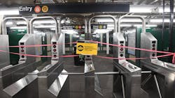 Closed signs on New York City subway turnstiles in May 2020. Those signs will spend two less hours on display starting Feb. 22 when MTA will partially reopen nightly subway service.