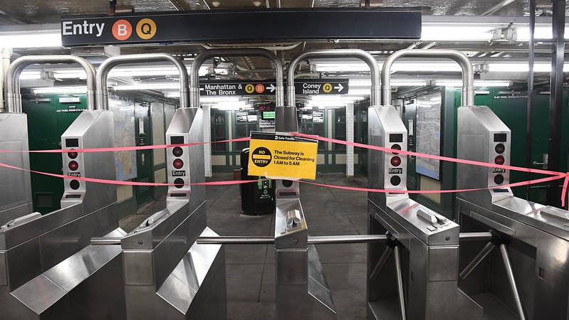 Closed signs on New York City subway turnstiles in May 2020. Those signs will spend two less hours on display starting Feb. 22 when MTA will partially reopen nightly subway service.