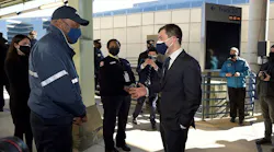 Secretary Buttigieg speaks with an Amtrak employee during his Feb. 5 visit to Washington Union Station.