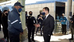 Secretary Buttigieg speaks with an Amtrak employee during his Feb. 5 visit to Washington Union Station.