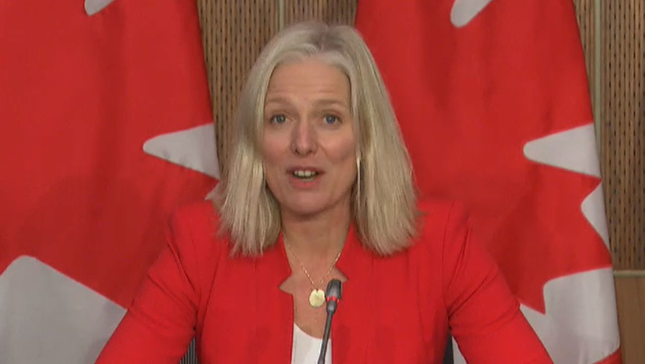 Minister Catherine McKenna speaks during a televised press conference announcing Canada's first dedicated rural transit fund.