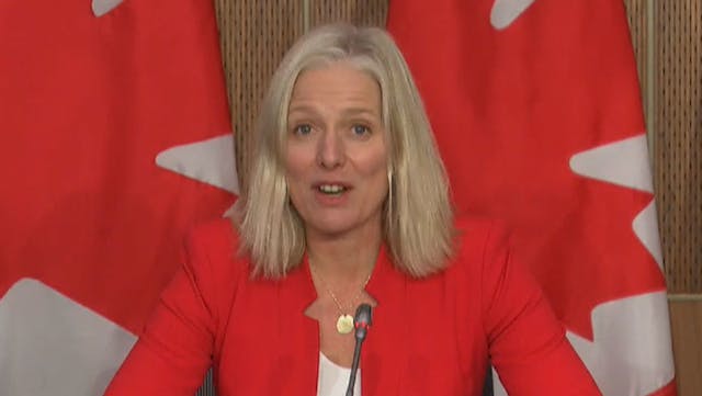 Minister Catherine McKenna speaks during a televised press conference announcing Canada&apos;s first dedicated rural transit fund.