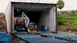 The method uses hydraulic jacks to move precast concrete boxes into place, creating a tunnel under the roadway