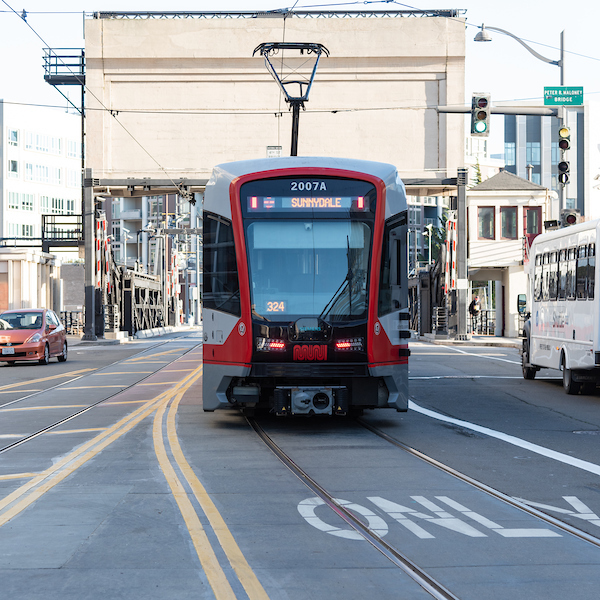 A Sunnydale-bound T Third train approaches the 4th Street Bridge.