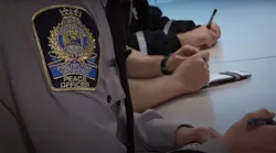 A Edmonton Transit Peace Officer insignia on the arm of a uniform.