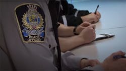 A Edmonton Transit Peace Officer insignia on the arm of a uniform. A Edmonton Transit Peace Officer insignia on the arm of a uniform.