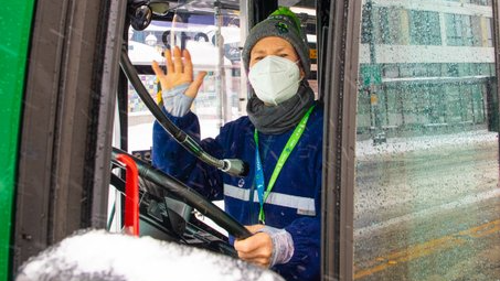 A King County Metro Transit bus operator at a stop this past winter.