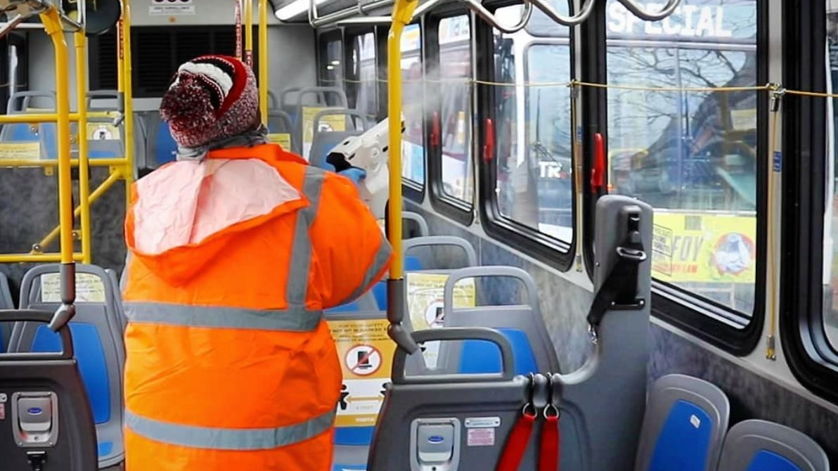 An images from February showing a MARTA employee using sanitizing spray inside a bus.