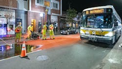 Construction crews installing bus lane markings on Broadway in Chelsea on October 21, 2020.