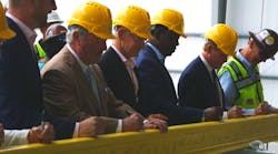 Officials from the community, Brightline and project workers signed a stick of rail to commemorate the halfway construction point.