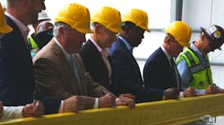Officials from the community, Brightline and project workers signed a stick of rail to commemorate the halfway construction point. Officials from the community, Brightline and project workers signed a stick of rail to commemorate the halfway construction point.