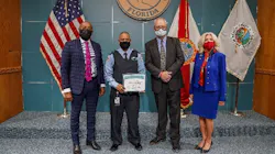Palm Tran Bus Operator Alberto Acevedo receives his graduation certificate.