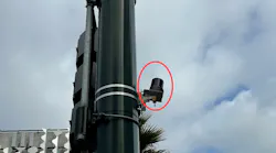 Sensor mounted on a traffic signal pole.
