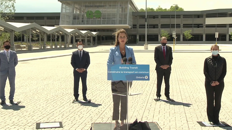 Minister Mulroney speaks during a virtual press conference June 16 announcing the June 28 opening of the Bloomington GO Transit Station, which can be seen in the background.