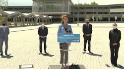 Minister Mulroney speaks during a virtual press conference June 16 announcing the June 28 opening of the Bloomington GO Transit Station, which can be seen in the background.