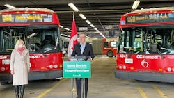 Ottawa Mayor Jim Watson, with Canada Minister of Infrastructure and Communities, at a March 2021 event announcing the federal government&apos;s commitment to helping transit agencies transition to zero-emission fleets. The city&apos;s Transit Commission has given approval to a plan that would eventually deliver 450 zero-emission buses to OC Transpo by 2027.