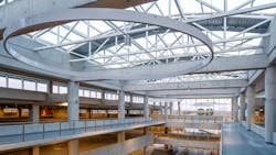 The building is open concept and has a large open-air glass enclosed atrium, which allows for plenty of natural lighting and views from all three levels of the garage. The building is open concept and has a large open-air glass enclosed atrium, which allows for plenty of natural lighting and views from all three levels of the garage.