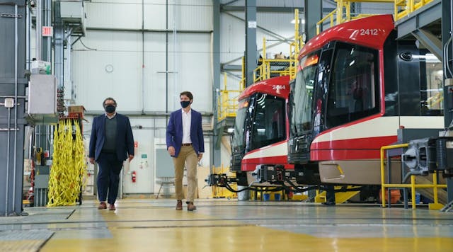 Calgary Mayor Naheed Nenshi, left, and Canada Prime Minister Justin Trudeau visit at the Calgary Transit Oliver Bowen Maintenance Facility on July 7, 2021.